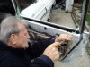 Wagon repair--Jim attaching outer window channel rubber 042212.jpg